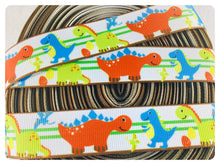 Load image into Gallery viewer, Ribbon by the Yard - 7/8" - Dinosaur Ribbon - Orange, blue, green