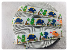 Load image into Gallery viewer, Ribbon by the Yard - 7/8" - Dinosaur Ribbon - Orange, Blue, Green