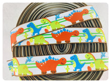 Load image into Gallery viewer, Ribbon by the Yard - 7/8&quot; - Dinosaur Ribbon - Orange, blue, green
