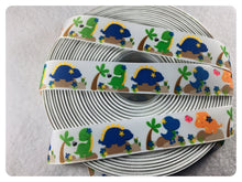 Load image into Gallery viewer, Ribbon by the Yard - 7/8&quot; - Dinosaur Ribbon - Orange, Blue, Green
